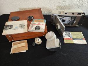 lot 24 image: Polaroid Land Camera Model 150 Along With Case