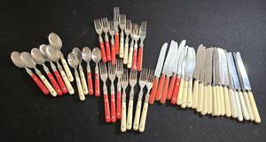 lot 195 image: Red & White Handled Flatware Set