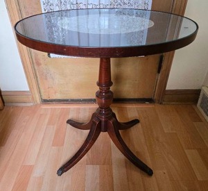 lot 47 image: Wooden End Table With Oval Glass Top