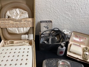 lot 329 image: Antique Toastmaster Beauty Hair Dryer, Stim-U-Lax Head Massager, Schnick Razor, and Shaver In A Metal Box