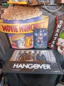 lot 68 image: Large Movie Munchies sign, Christmas Vacation, The Hangover and Theater signs.
