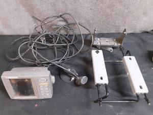 lot 85 image: Lowrance fish finder with mount and transducer. clamp on boat seat mount