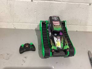 lot 424 image: Monster Jam, Official Grave Digger Trax All-Terrain Remote Control Outdoor Vehicle
