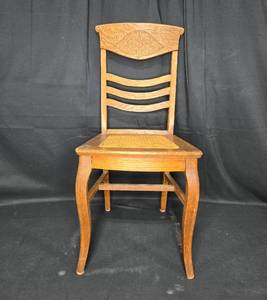 lot 138 image: Vintage Wooden Chair with Intricate Carved Backrest and Cane Seat