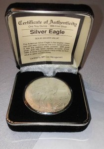 lot 585 image: AMERICAN SILVER EAGLE 2000 Dollar Coin in Case with COA.