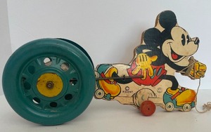 lot 7 image: Antique Mickey Mouse Pull Toy Wood Body with Brass Wheels N.N. Hill Co. Easthampton CT