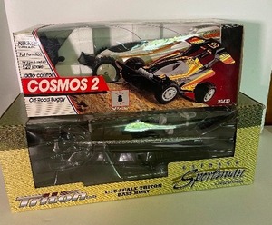 lot 18 image: New in Box Lot of 2 Scaled Collectibles Vehicles One Radio Controlled Nikko and Ertl