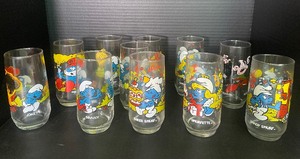 lot 27 image: 1980s Smurf Drinking Glass Set of 11