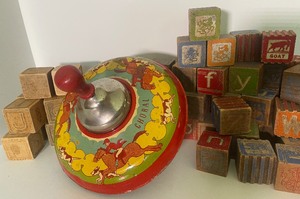 lot 29 image: Vintage Tin Litho Ohio Art Spinning Top with Wood Handles and Wood Blocks