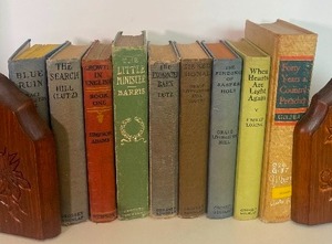 lot 71 image: Wood Bookends with Vintage Hardcover Books