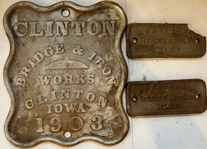 lot 166 image: Clinton Iowa Bridge Cast Iron Sign and Two Aybange & Co. Mpls MN Cast Iron Tag