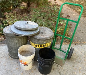 lot 169 image: Nine Piece LOT - Two Galvanized Garbage Cans with Lids, Two-Wheel Dolly, Two 5Gal Buckets