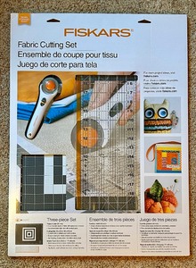 lot 58 image: New Fiskars Three Piece Fabric Cutting Set