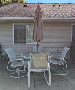 lot 131 image: Glass Topped Patio Set and Umbrella