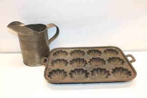 lot 229 image: Vintage Tin Water Pitcher and Cast Iron Shell Mold Baking Tray