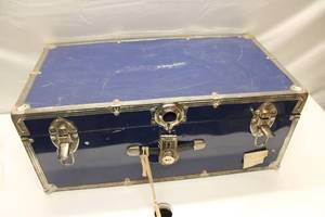 lot 325 image: Vintage Blue Metal Trunk with Newspaper Lining