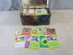 (EC1) Assorted Pokemon Cards in Met...