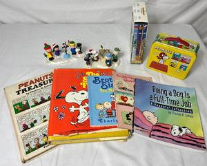 lot 121 image: Vintage Peanuts Collection of Books, Movies, Lunch Box and Hallmark Ornaments