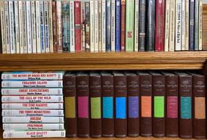 lot 41 image: American Classics Literature Series- Louis LAmour (40 Paperbacks), Great Illustrated Classics  (9 Hardcovers), Readers Digest Family Treasure of Great  Biographies (11 Hardcovers)
