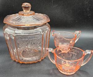 lot 17 image: Vintage Anchor Hocking Pink Depression Glass Rose Cookie Jar and Pink Depression Glass Cream and Sugar
