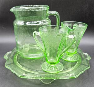 lot 13 image: 1930s Anchor Hocking Depression Uranium Glass - Cameo Footed Cake Plate, Cameo Pitcher, Creamer, and Sugar Bowl