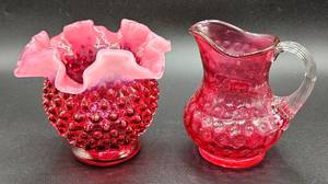 lot 12 image: Fenton Cranberry Hand Blown Pitcher 4.5 H and Fenton Cranberry Opalescent Ruffled Edge Hobnail Vase 4.5 H