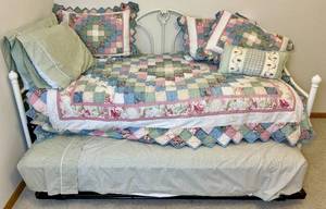lot 77 image: Twin Size Metal Daybed with Trundle Bed includes bedding and mattresses (if wanted)