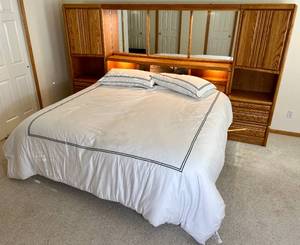 lot 79 image: Blackhawk Furniture King  Lighted Wall Unit with Side Towers includes bedding and 2Restonic Mystical Firm twin mattress sets (optional)