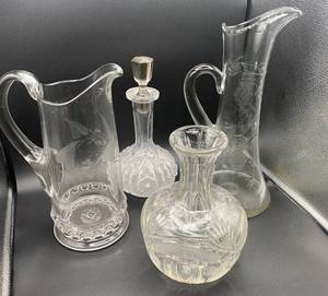 lot 91 image: Collection of 4 Crystal and Hand Blown Glass Pitchers and Decanters - Glows Green Under 365nm wavelength blacklight