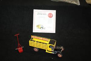 lot 1617 image: 1927 Ford Coca-Cola Delivery Truck with Bottles and Hand Cart Diecast Metal Collectible 124 Scale with Certificate of Authenticity