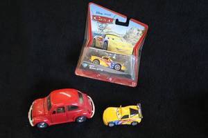 lot 1678 image: Lot of (3) Collectible Cars - Disney Pixar CARS Jeff Gorvette (in original package),  Disney Pixar CARS Jeff Gorvette and Red Volkswagon Beetle