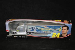 lot 1691 image: Winners Circle #24 Jeff Gordon DuPont NASCAR Trailer Rig Collectible 164 Scale (in original box)
