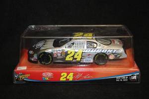 lot 1697 image: Winners Circle #24 Jeff Gordon DuPont NASCAR Diecast Metal Collectible 124 Scale (in original box)