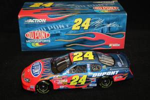 lot 1703 image: Action Collectibles #24 Jeff Gordon DuPont 2003 Monte Carlo Diecast Metal Collectible 124 Scale (in original box)