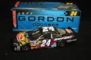 lot 1705 image: Action Collectibles #24 Jeff Gordon DuPont Foose Custom Design 2006 Monte Carlo Diecast Metal Collectible 124 Scale (in original box)