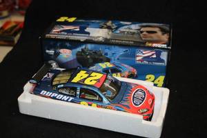 lot 1704 image: Action Collectibles #24 Jeff Gordon DuPont Salute The Troops 2008 Impala SS Diecast Metal Collectible 124 Scale (in original box)