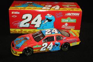 lot 1707 image: Action Collectibles #24 Jeff Gordon DuPont Sesame Street II 2003 Monte Carlo Diecast Metal Collectible 124 Scale (in original box)