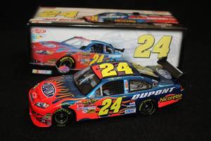lot 1708 image: Action Collectibles #24 Jeff Gordon DuPont 2007 Impala SS COT Diecast Metal Collectible 124 Scale (in original box)