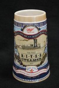 lot 1796 image: Ceramarte (Brazil) The Carolina Collection Fourth in a Series Miller High Life - Great American Acheivements - The First River Steamer 1807 Collectors Beer Tankard 7-14
