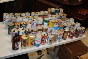 lot 1837 image: Lot of (64) Vintage Beer Cans - Olympia, Hamms, Guiness, Kodiak, Pabst Blue Ribbon, Karlsbrau, Newcastle and more
