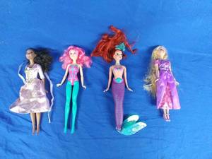 lot 210 image: Set of 4 Collectible Mattel Barbie Dolls Disney, Arial, and Others