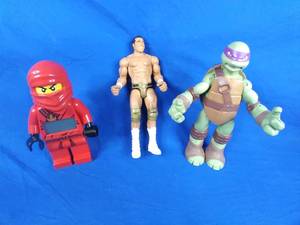 lot 243 image: Lot of 3 Action Figures Lego, WWF, and TMNT