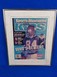 lot 263 image: Framed and Matted 12x 14 2001 Randy Moss MN Vikings NFL Sports Illustrated KIDS Cover