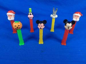 lot 270 image: Lot of 7 Pez Dispensers Disney, Mickey, Bugs Bunny, Santa, and Others