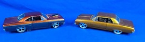 lot 272 image: Set of (2) 124 Scale Cast Iron Cars