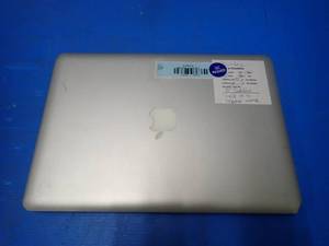 lot 31 image: Apple&nbspMacBookPro9,2 A1278 &nbspINTEL CORE I5-3210M 2.5 Ghz  4GB DDR3 SDRAM  500GB HD  13.3 screen with 1280 x 800 Resolution  Includes IOS and Charger &nbspcorner dented in