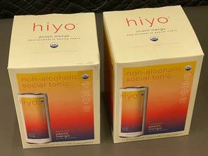 lot 304 image: 2 back - Hiyo Organic Peach Mango Non-Alcoholic Social Tonic - 8 Cans