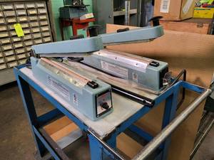 lot 137 image: (2) 12 Uline impulse sealers and b...