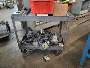 lot 396 image: Metal shop cart with a variety of E...