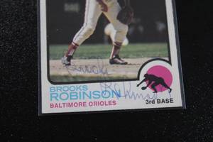 lot 42 image: 1973 Topps Brooks Robinson #90 In Person Autograph Damaged - See Description